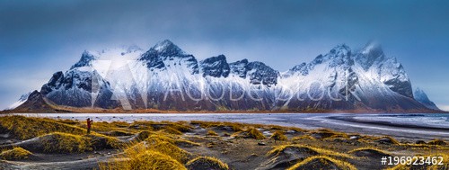 Vestrahorn mountain range and Stokksnes beach panorama, near Hofn, Iceland. An unidentifiable photographer captures the scenery.