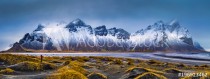 Vestrahorn mountain range and Stokksnes beach panorama, near Hofn, Iceland. An unidentifiable photographer captures the scenery. Naklejkomania - zdjecie 1 - miniatura