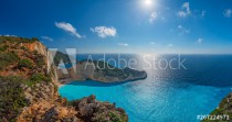Panoramic view of the sun shining over cliffs in Shipwreck Cove Naklejkomania - zdjecie 1 - miniatura