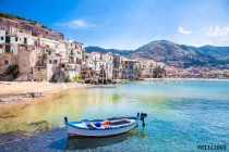Old harbor with wooden fishing boat in Cefalu, Sicily Naklejkomania - zdjecie 1 - miniatura