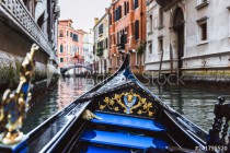 Traditional gondola on narrow canal in Venice, Italy Naklejkomania - zdjecie 1 - miniatura
