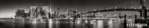 Panoramic Black and white view of Lower Manhattan Financial District skyscrapers at twilight with the Brooklyn Bridge and East River. New York City - zdjęcie 1