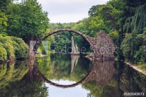 Rakotz bridge (Rakotzbrucke) also known as Devil's Bridge in Kromlau, Germany. Reflection of the bridge in the water create a full circle. Naklejkomania - zdjecie 1 - miniatura