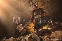 Attack of powerful knight in heavy armor on the dungeon backgrou Naklejkomania - zdjecie 1 - miniatura
