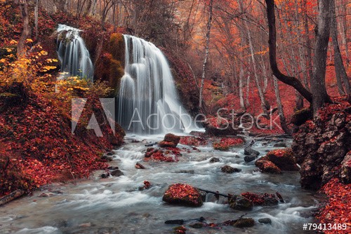Beautiful waterfall in autumn forest - zdjęcie 1
