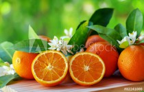 orange fruits and flowers on table Naklejkomania - zdjecie 1 - miniatura