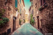 Narrow street in an old Italian town of Pienza. Tuscany, Italy. Vintage Naklejkomania - zdjecie 1 - miniatura