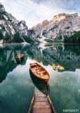 Boats and slip construction in Braies lake with crystal water in background of Seekofel mountain in Dolomites in morning, Italy Pragser Wildsee Naklejkomania - zdjecie 1 - miniatura
