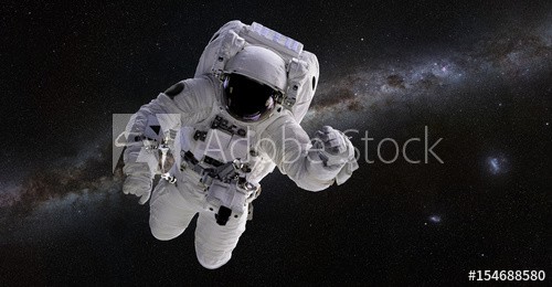 Astronaut in front of the Milky Way galaxy