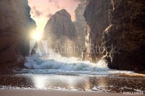 Fantastic big rocks and ocean waves at sundown time. Dramatic Naklejkomania - zdjecie 1 - miniatura