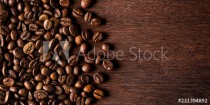 fresh roasted coffee beans on natural dark oak wood panorama wide wooden closeup macro background Naklejkomania - zdjecie 1 - miniatura