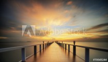 Wooded bridge in the port between sunrise. Naklejkomania - zdjecie 1 - miniatura