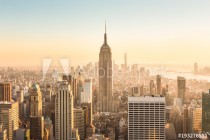 New York City. Manhattan downtown skyline with illuminated Empire State Building and skyscrapers at amazing golden sunset. USA. Naklejkomania - zdjecie 1 - miniatura