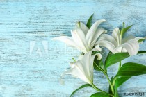 Beautiful white lilies on color wooden background Naklejkomania - zdjecie 1 - miniatura