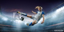 Female Soccer player in action on a professional soccer stadium. Girl playing soccer Naklejkomania - zdjecie 1 - miniatura
