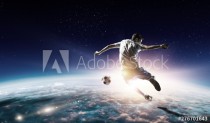 Soccer player in outer space in action. Mixed media Naklejkomania - zdjecie 1 - miniatura