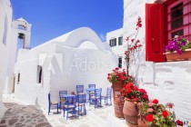 Traditional greek street with flowers in Amorgos island, Greece Naklejkomania - zdjecie 1 - miniatura
