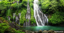Jungle waterfall cascade in tropical rainforest with rock and turquoise blue pond. Its name Banyumala because its twin waterfall in mountain slope Naklejkomania - zdjecie 1 - miniatura