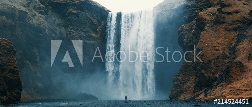 Woman overlooking waterfall at skogafoss, Iceland. Skógafoss, Ísland.