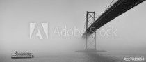 Ferry boat crossing under a suspension bridge in Halifax, Nova Scotia in thick fog. Naklejkomania - zdjecie 1 - miniatura