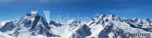 Panoramic view of snow-capped mountain peaks