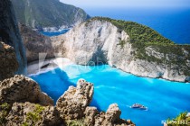 Navagio beach or Shipwreck bay with turquoise water and pebble white beach. Famous landmark location. Landscape of Zakynthos island, Greece Naklejkomania - zdjecie 1 - miniatura